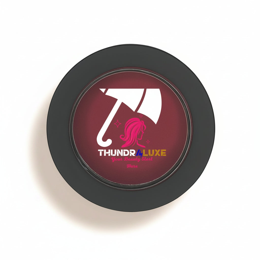 Black circular product with 'THUNDR4LUXE' logo featuring an umbrella and pink hair on a white background