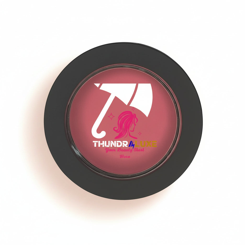Round pink compact mirror with 'THUNDR4LUXE' branding on a white background