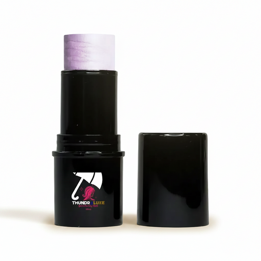 Black makeup stick with purple top and visible brand logo on a light gray background