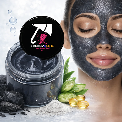 Thundraluxe charcoal mask jar with a woman wearing the mask, aloe vera leaves, and gold capsules on a white background.