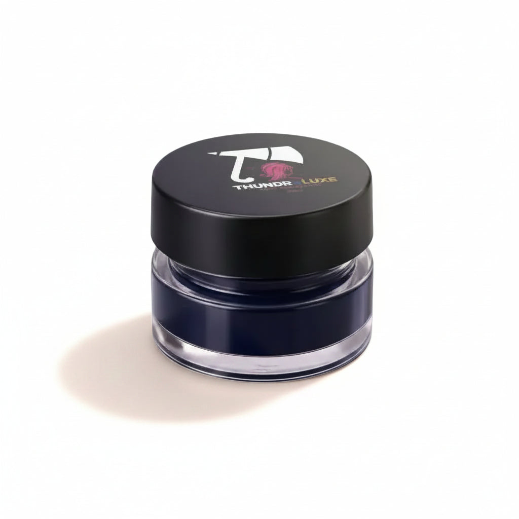 Blue eye makeup product with 'Thunder Luxe' branding on a glittery background