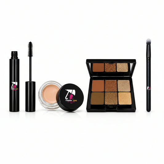 Makeup products including a mascara, eyeliner, cream, compact powder, and brush on a white background.