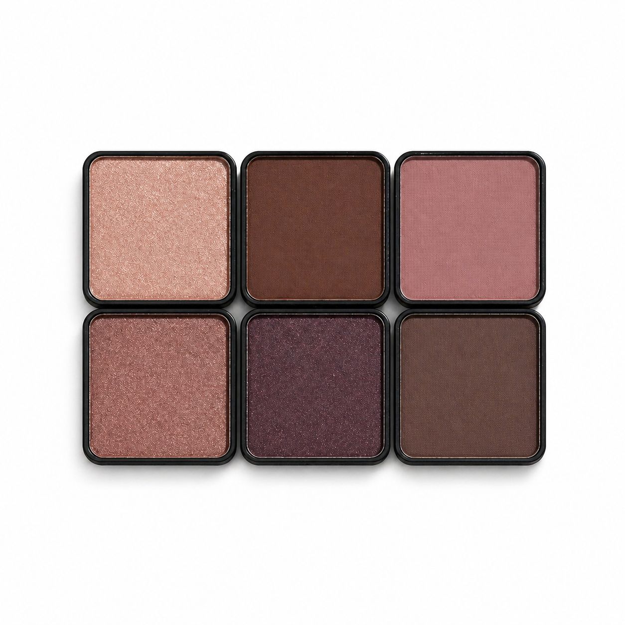 Set of six eyeshadow pans in various shades on a white background