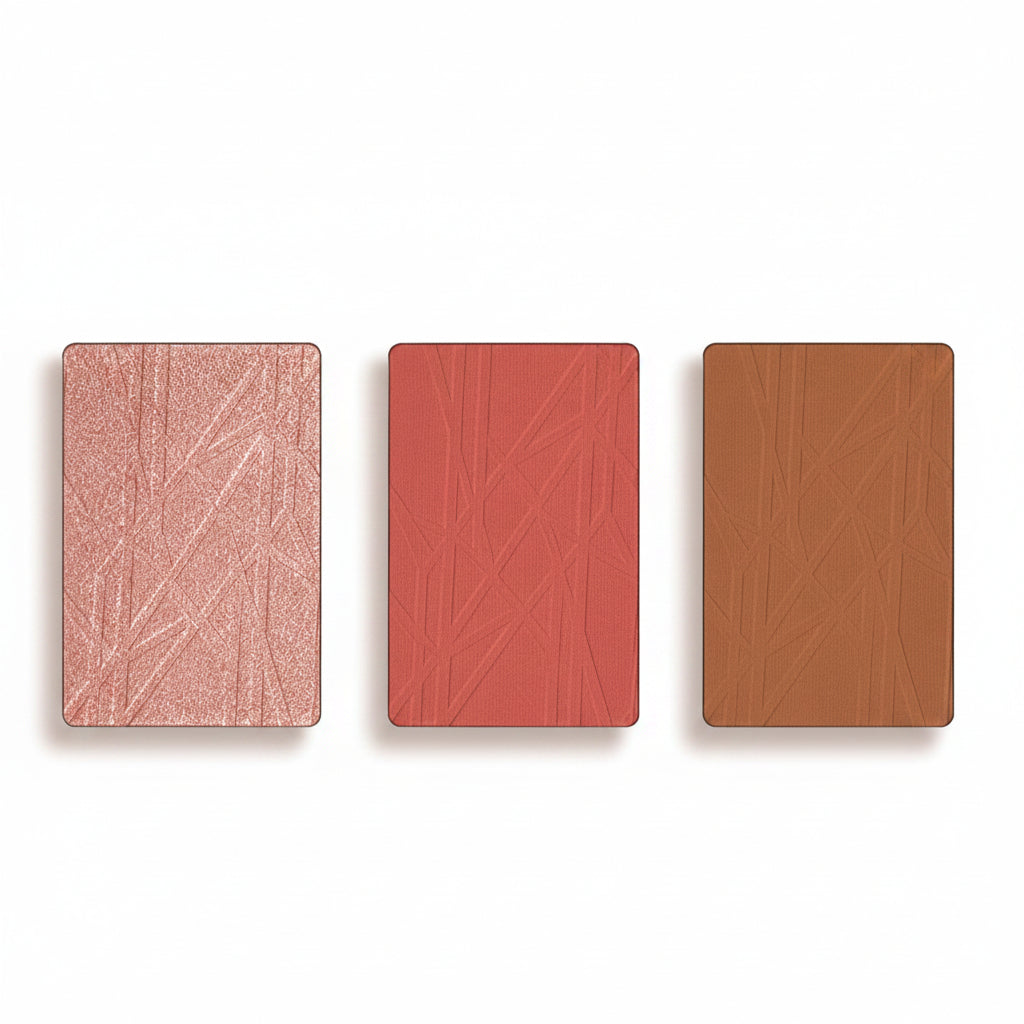 Three rectangular blush shades with textured surfaces on a white background